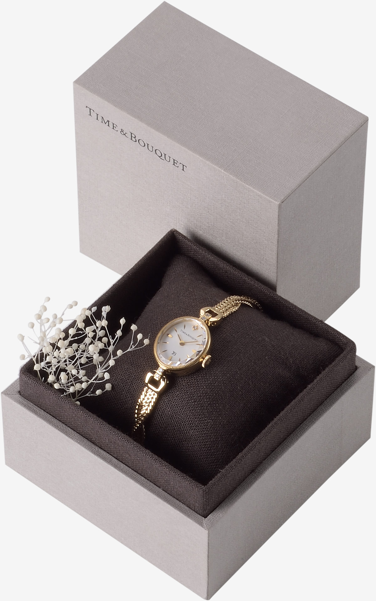ハーフリネンの生地を内張りとクッションに使用した贅沢なギフトボックスに収納した腕時計ミュゲ
